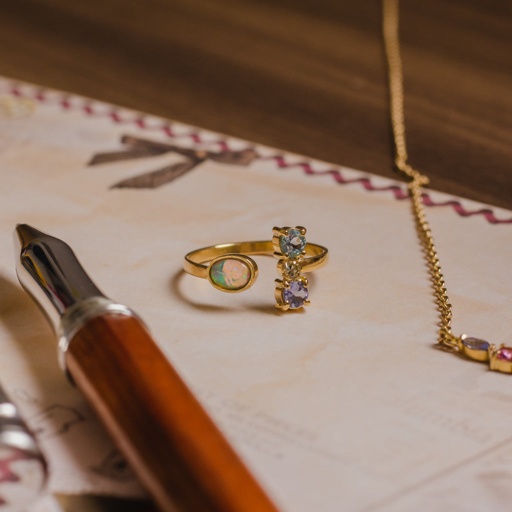 Anel Zora II Água Marinha, Tanzanita, Opala, Brilhante e Ouro 18k Kahla